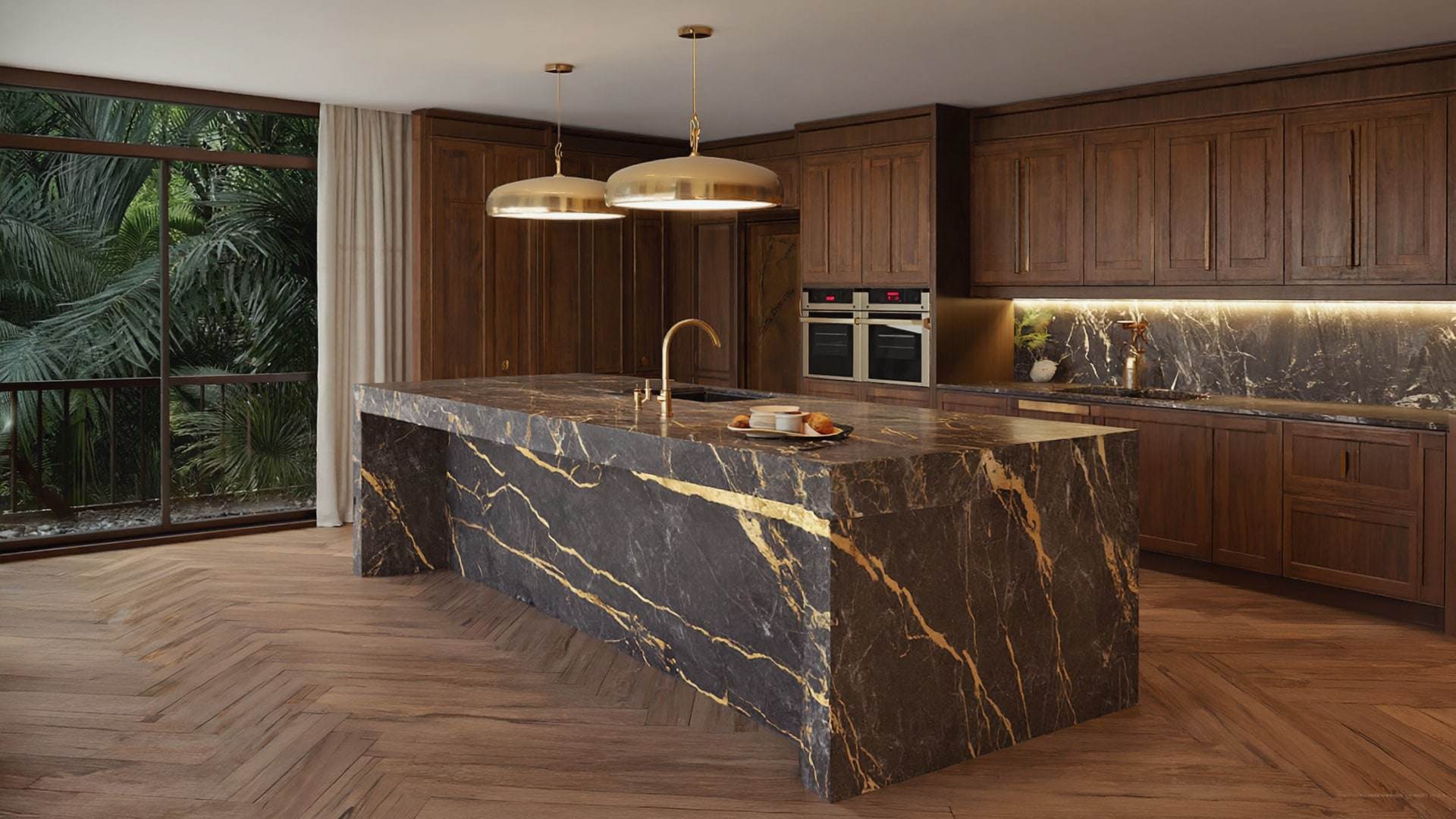 A kitchen with a dark marble island veined in gold and fluted walnut cabinetry.